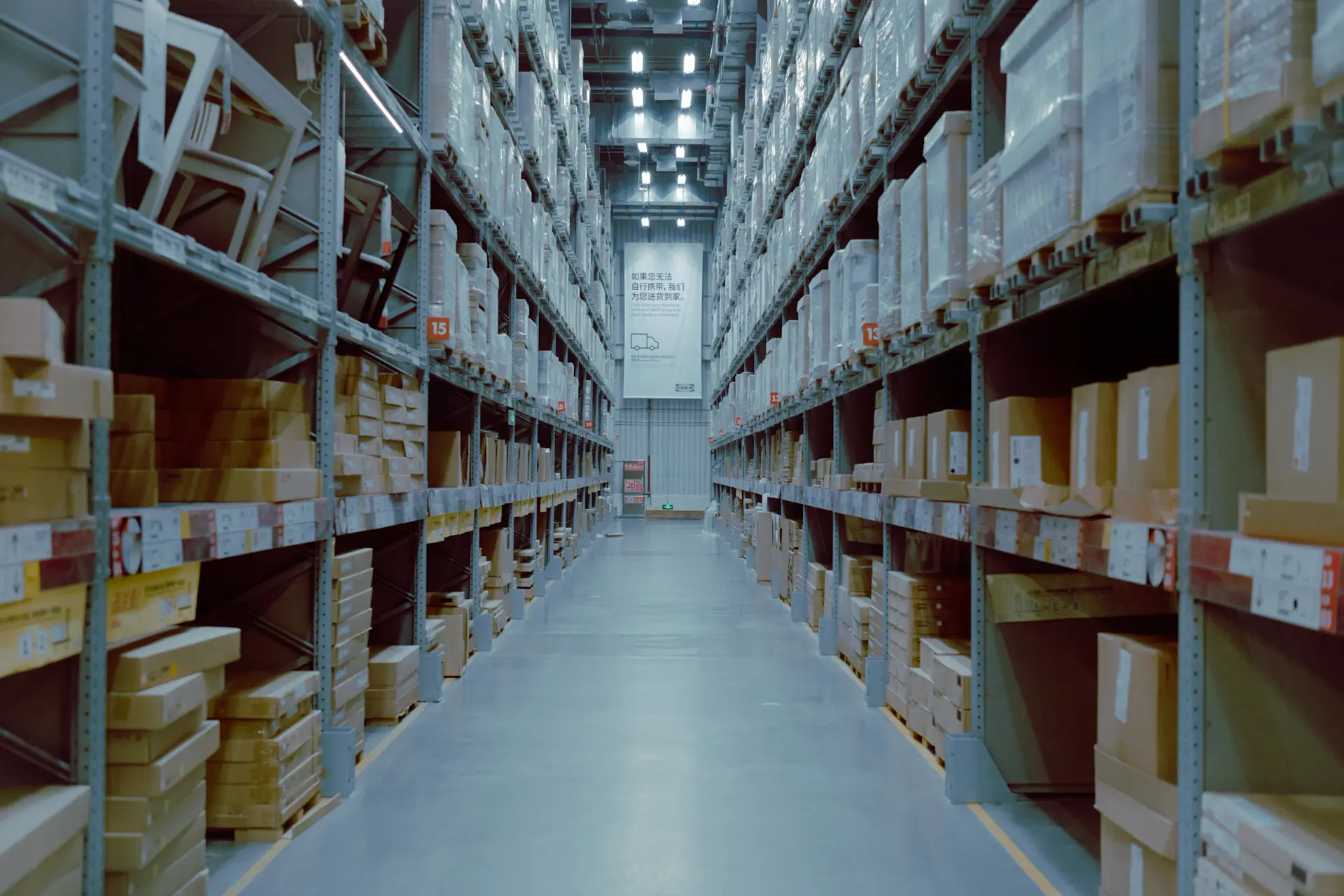 Warehouse aisle with racking, contact Barns Industrial Battery Services Brentwood